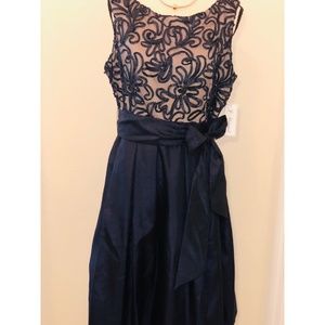 Sleeveless Tie Waist Dress with Pleated Skirt